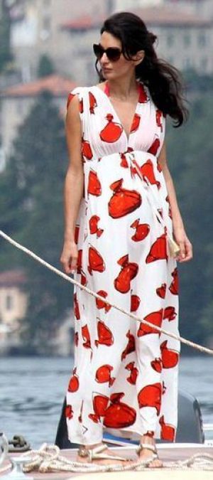 Amal Alamuddin Clooney in a red and white maxi dress while on a boat with George Clooney in Lake Como.jpg